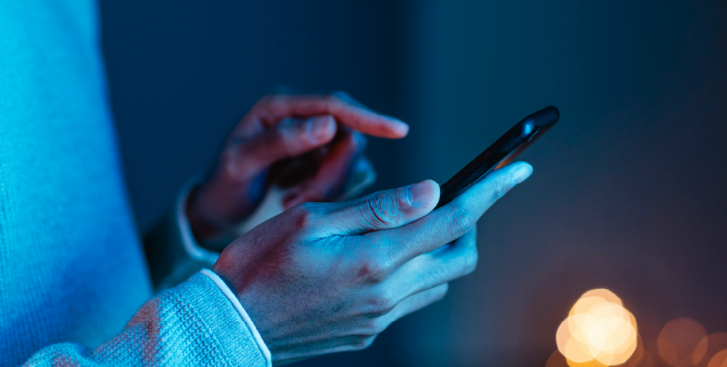 Mobile app development approach showing user interacting with smartphone