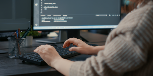 Developer coding custom software solutions for business optimization
