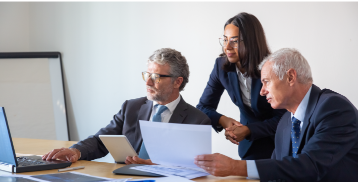 Business professionals reviewing Cloud Compliance and Governance strategy