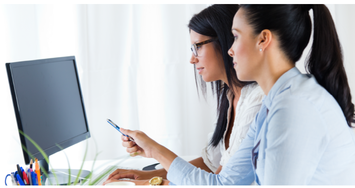Professionals discussing cloud training and support strategies at the workplace
