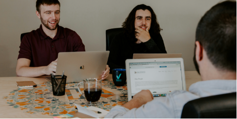 IT team discussing Cloud Strategy Consulting plans during a business meeting